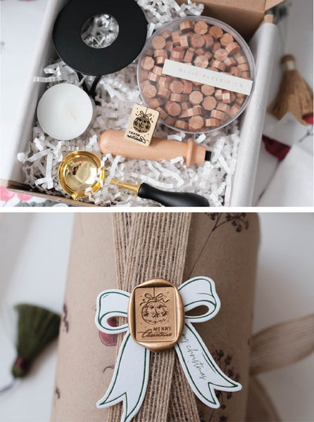 Christmas wax seal kit with Merry Christmas ornament wax stamp, peachy gold sealing wax beads, and melting tools