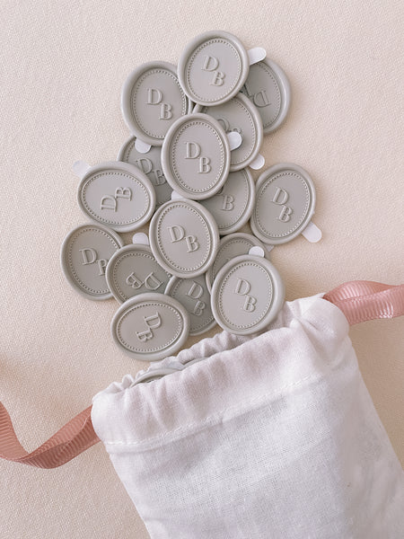 Oval border design monogram grey wax seals in linen pouch