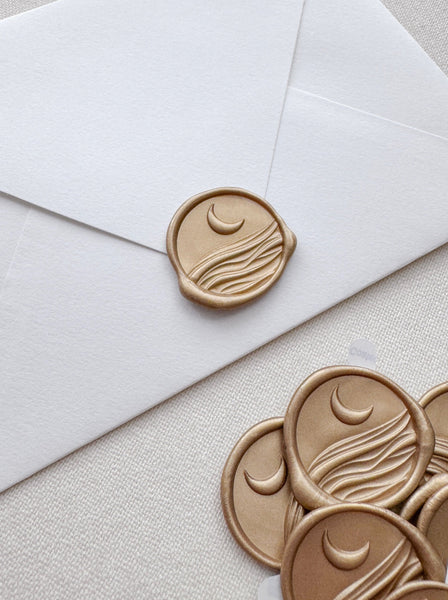 Light gold colored moon and ocean waves wax seal stickers with 3D engraving details