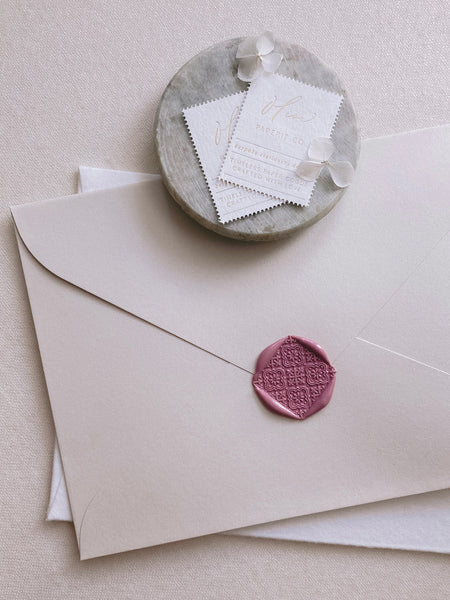 Nora moroccan tile wax seals in rosewood on paper envelope