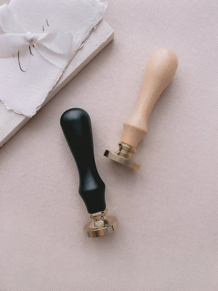 wax seal stamps with black and wooden handles