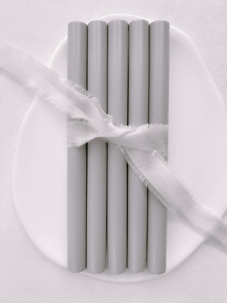 a set of 5 sealing wax sticks in light gray