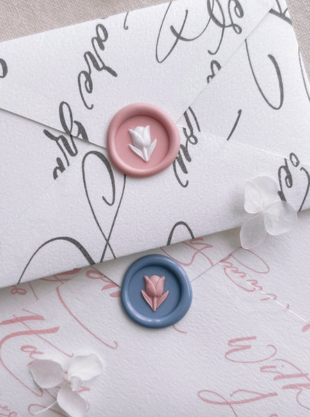 flower emoji mini wax seals in light pink and dusty blue