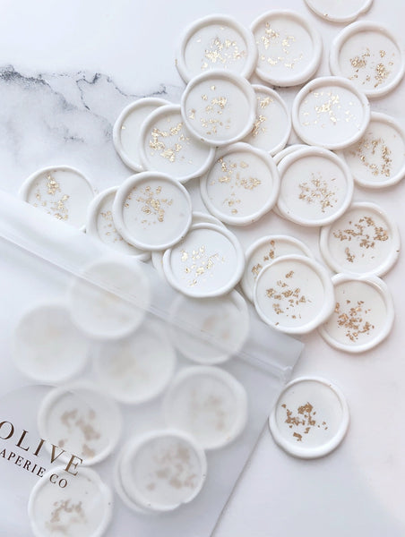a bundle of gold leaf white wax seals out of packaging bag
