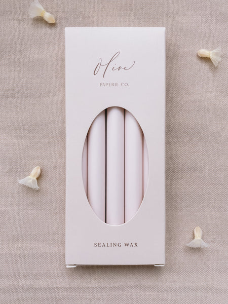 a box of 5 glue gun sealing wax sticks in ivory nude color