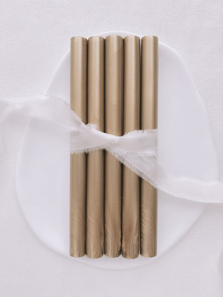 a set of 5 light gold glue gun sealing wax sticks