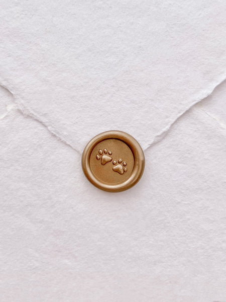 3D paw print mini gold wax seal on white handmade paper envelope