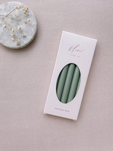 a box of 5 sage green sealing wax sticks_side angle
