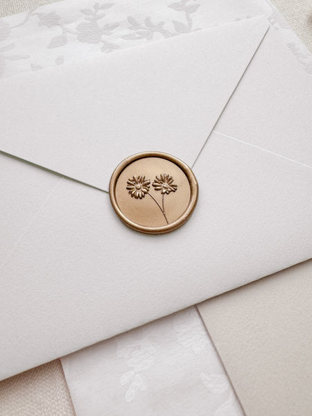 Daisies gold wax seal with 3D engraving details on a light beige envelope