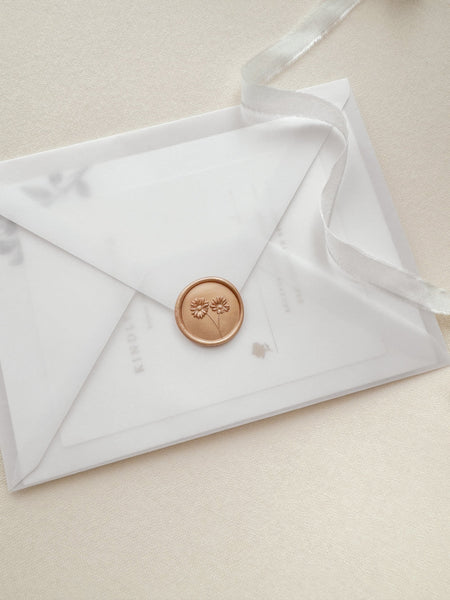 Daisies wax seal in color peachy gold with 3D engraving details on a vellum envelope