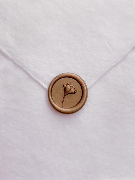 3D mini flower wax seal in gold on handmade paper envelope_front angle