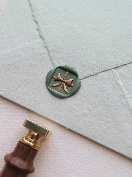 two-toned green and gold 3D gift bow wax seal