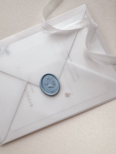 Butterflies wax seal with 3D engravings in color dusty blue on a vellum envelope