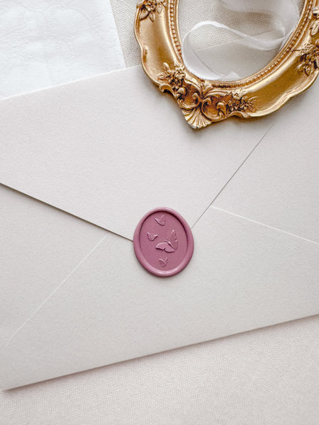 Butterflies wax seal with 3D engravings in color Rosewood on a light beige envelope