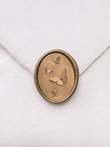 Butterflies gold wax seal with 3D engravings on a white handmade paper envelope