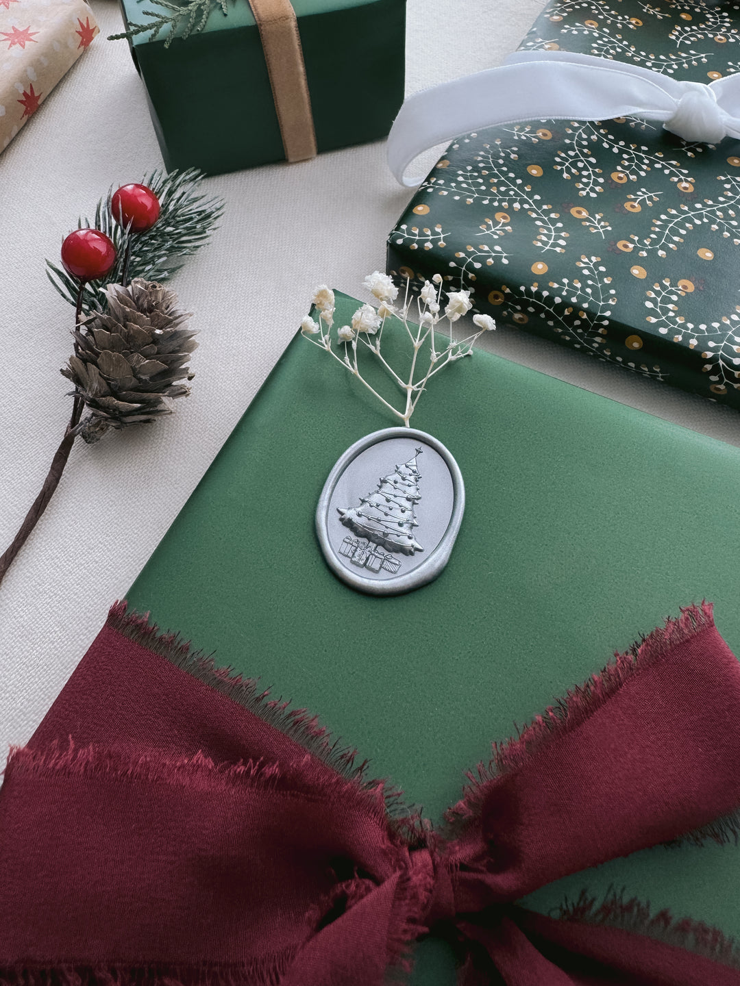 silver 3D Christmas tree wax seal decorated on a Christmas gift