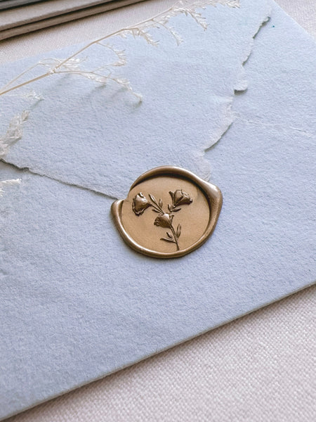 3D flower bouquet gold wax seal on pale blue envelope