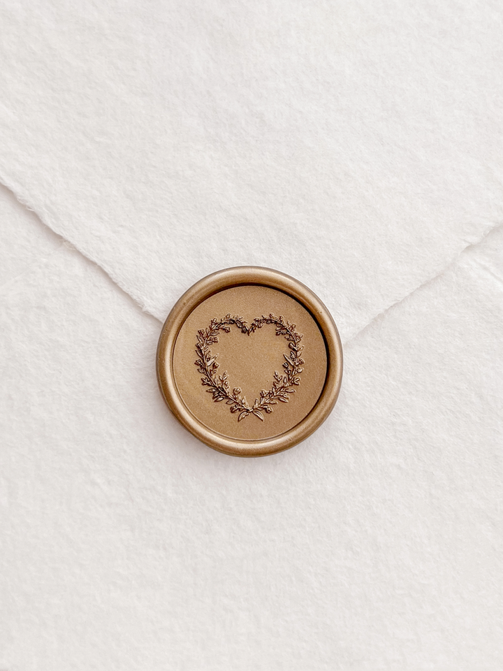 Gold 3D heart shaped botanical wreath wax seal on white deckled edge handmade paper envelope 