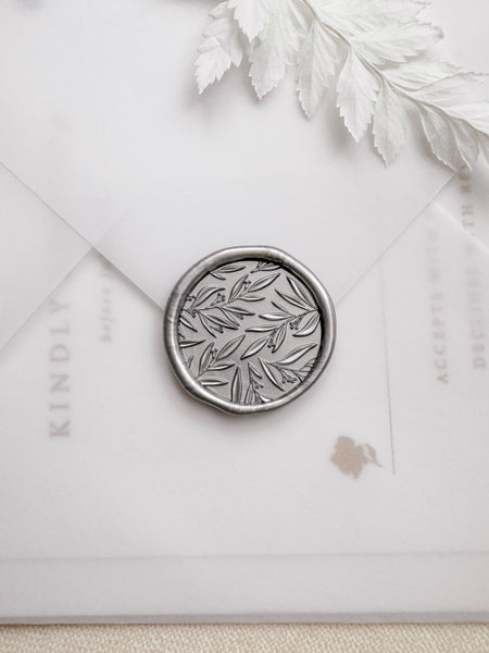 Silver leaf pattern botanical wax seal with 3D engraving details on a vellum envelope