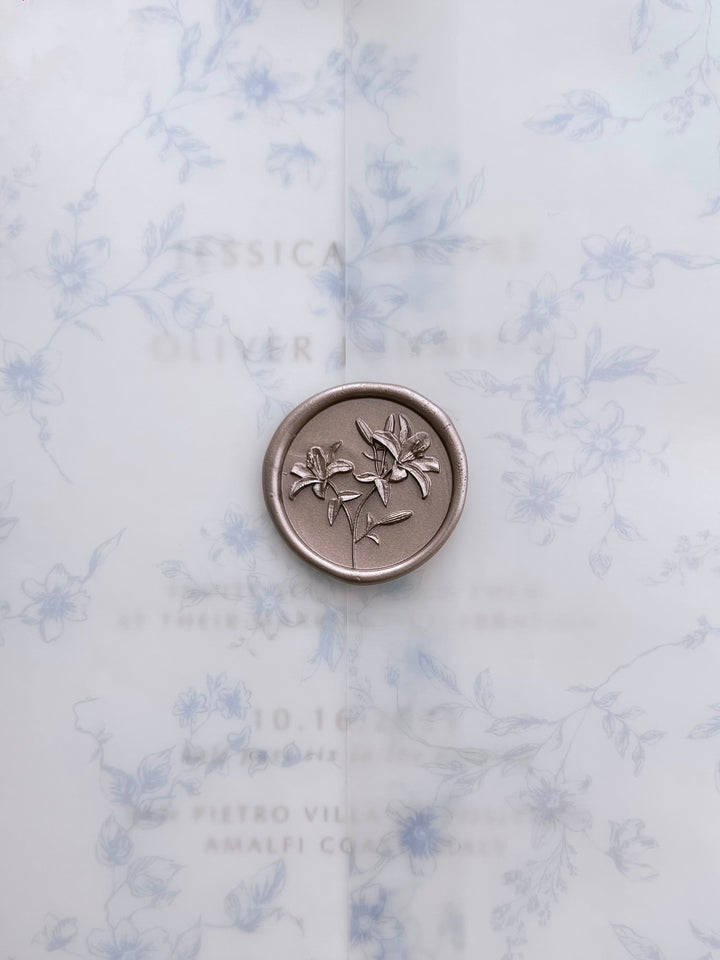 Light bronze 3D lily flowers wax seal on a blue botanical print vellum jacket