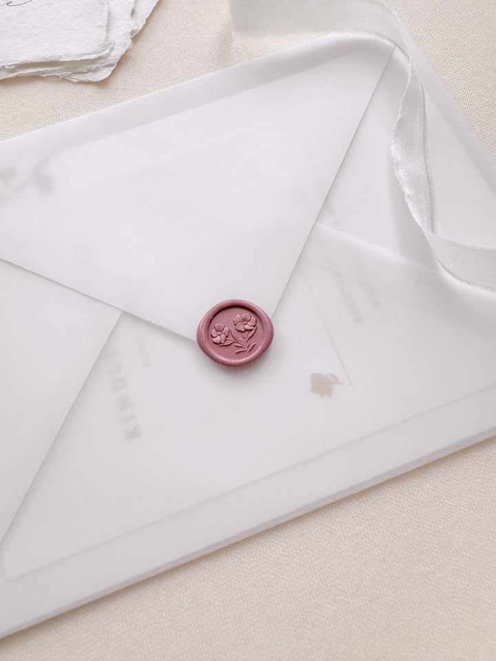 rose pink 3D mini gardenia floral wax seal on a vellum wedding invitation envelope 