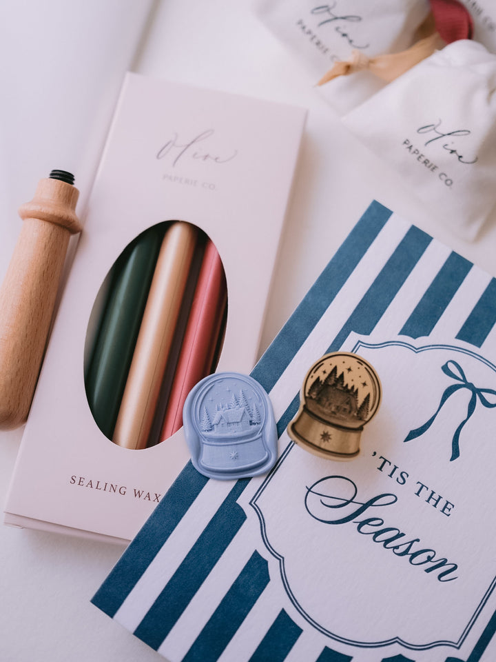 Dusty blue North Star snow globe wax seal styled with festive sealing wax sticks, &