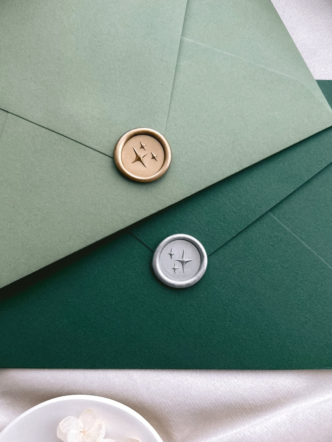 Gold and silver 3D stars mini wax seals on light green and dark green envelopes
