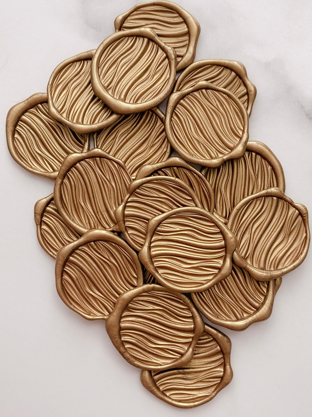 Gold ocean waves wax seals in 3D engraving