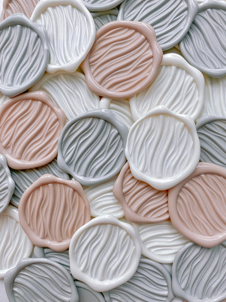 gray, white, and nude wave wax seals with 3D engraving