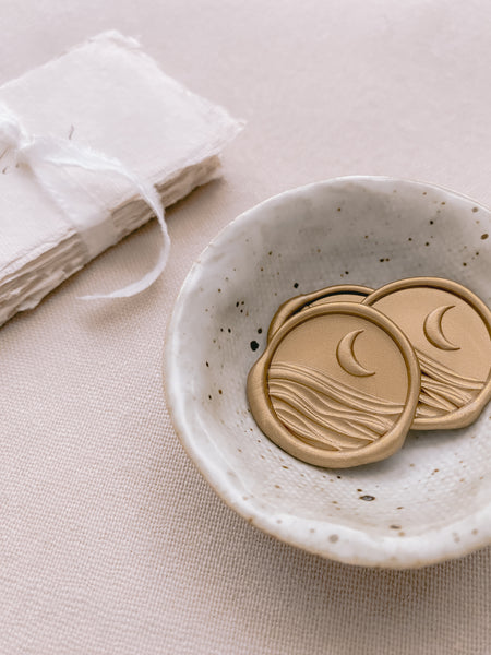 3D moon and ocean wax seals in classic gold