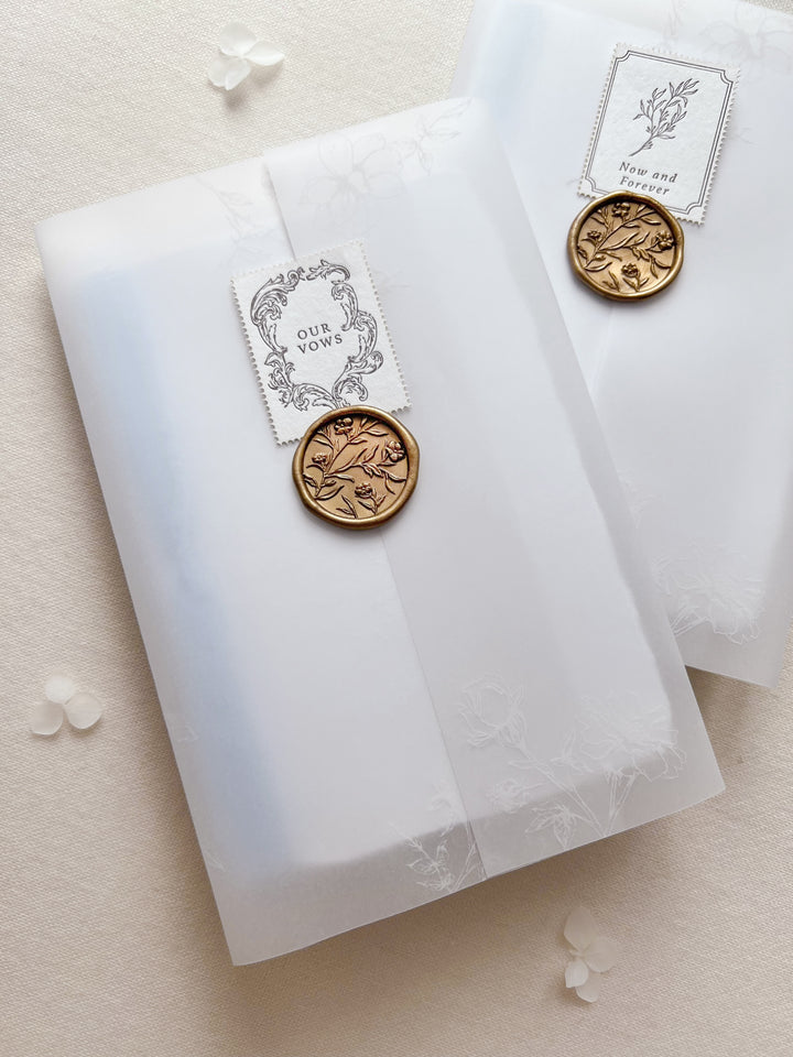 vow books packaged in a vellum jacket, gold wax seal and a letterpress postage stamp