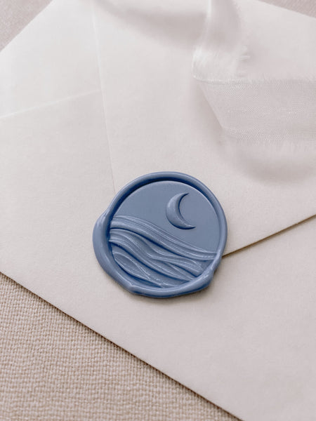 3D moonlight wax seal in dusty blue on paper envelope