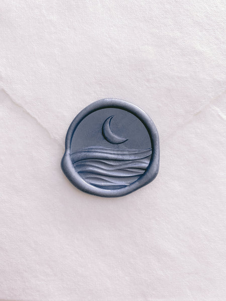 3D moonlight wax seal in blue on beige handmade paper envelope