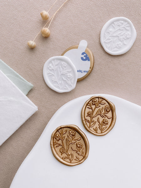 Oval floral wax seals with 3D engraving in off-white and light gold with 3M stickers