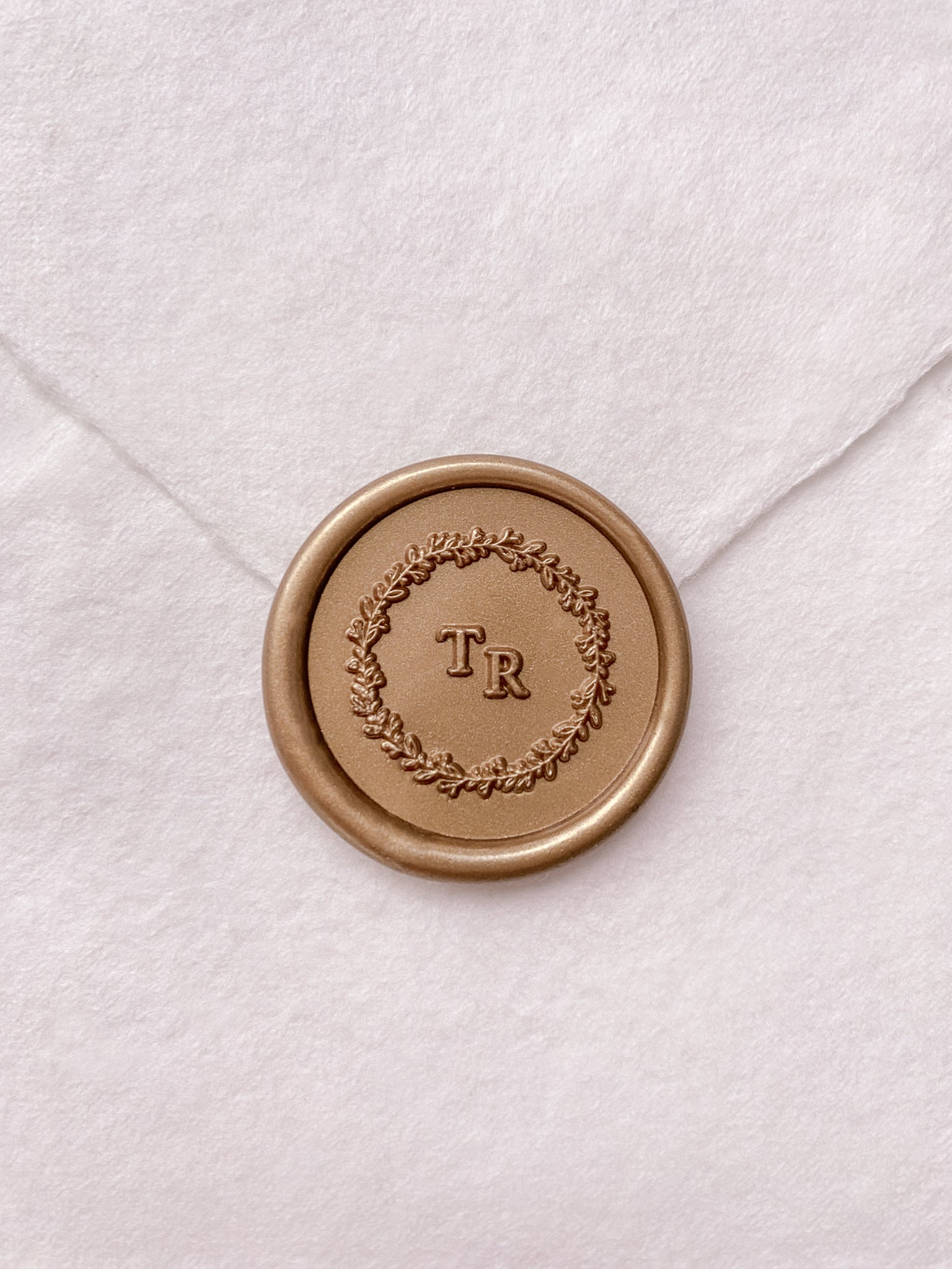 leaf wreath monogram gold custom wax seal on beige handmade paper envelope