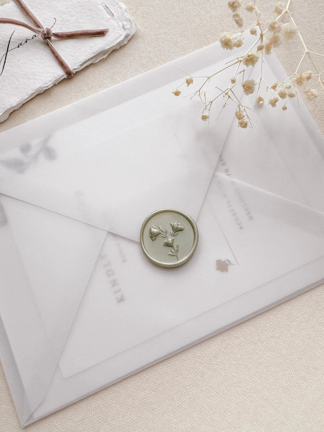light sage 3D floral wax seal on vellum wedding initiation envelope