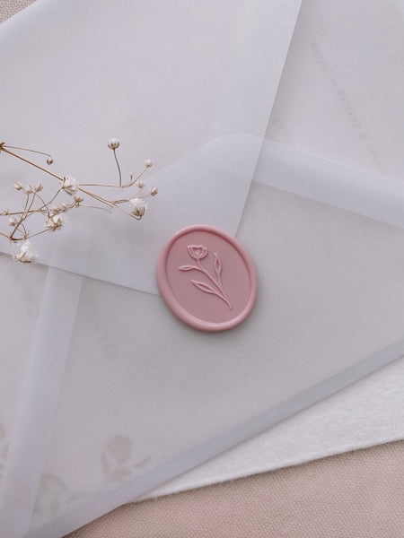 simple flower wax seal in blush color on vellum envelope_side angle