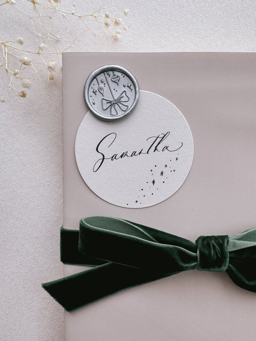 silver ornament design wax seal on gift wrap