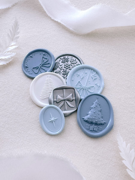 assorted blue, silver and white Christmas envelope seals