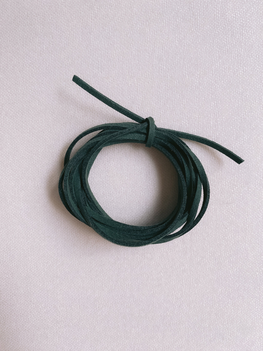 Christmas dark green suede ribbon close up