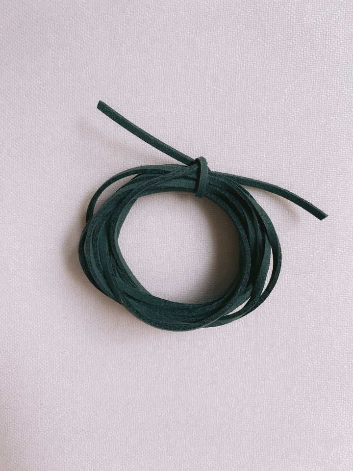 Christmas dark green suede ribbon close up