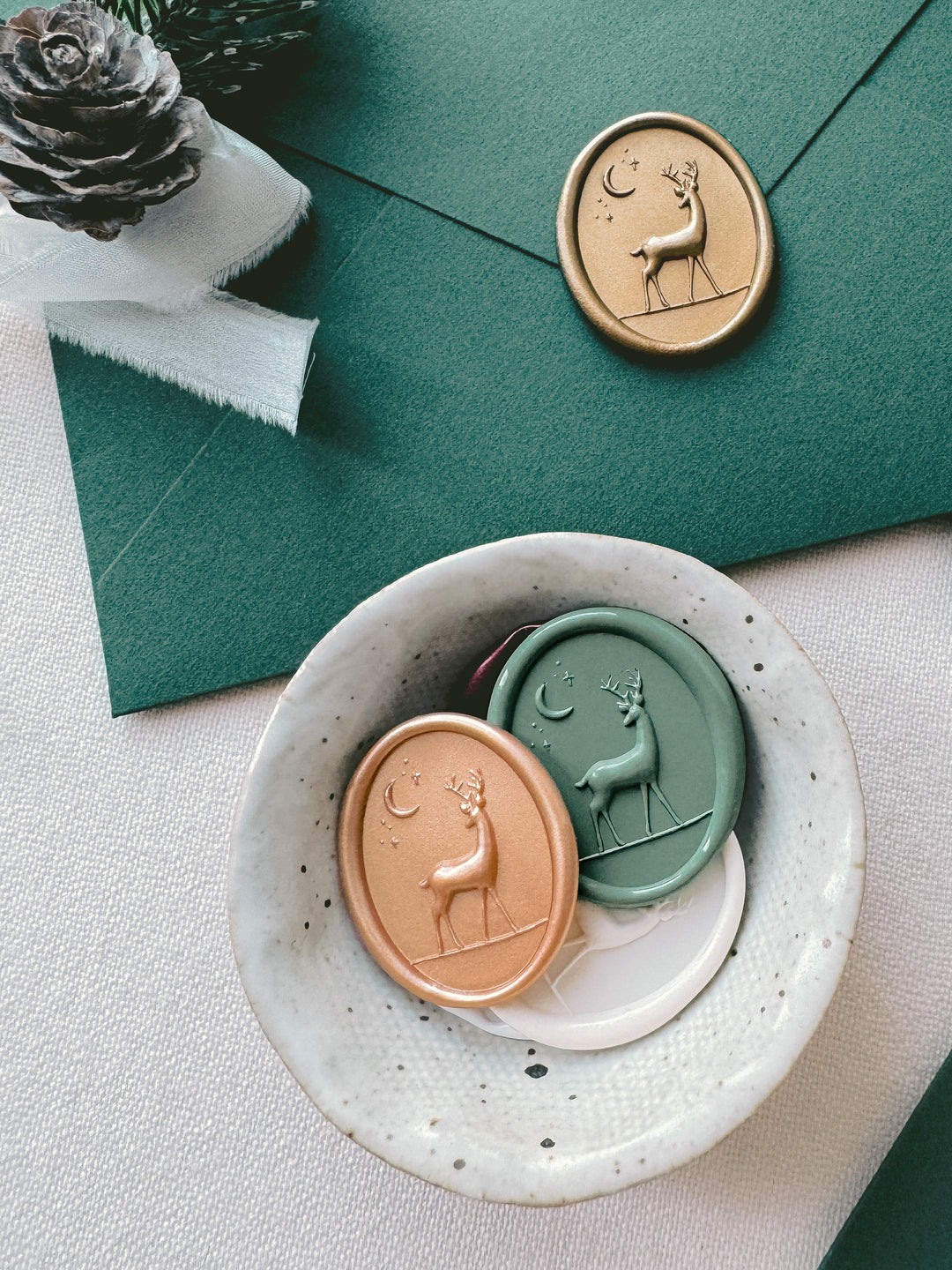 3D reindeer envelope seals in festive colors on Christmas cards