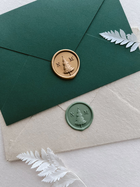 Christmas tree desgin personalized monogram wax seals in gold and green on green and beige Christmas card envelopes
