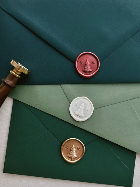 Custom initials Christmas tree monogram wax seals on green envelopes