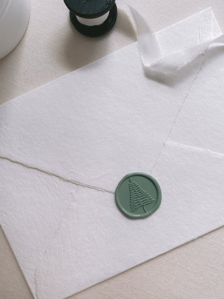 Christmas tree wax seal in sage green on white handmade paper envelope