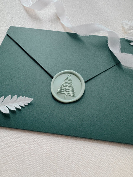 Light green Christmas wax seal decorated on Christmas card envelope