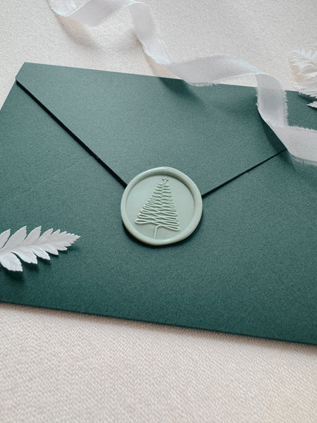 Light green Christmas wax seal decorated on Christmas card envelope