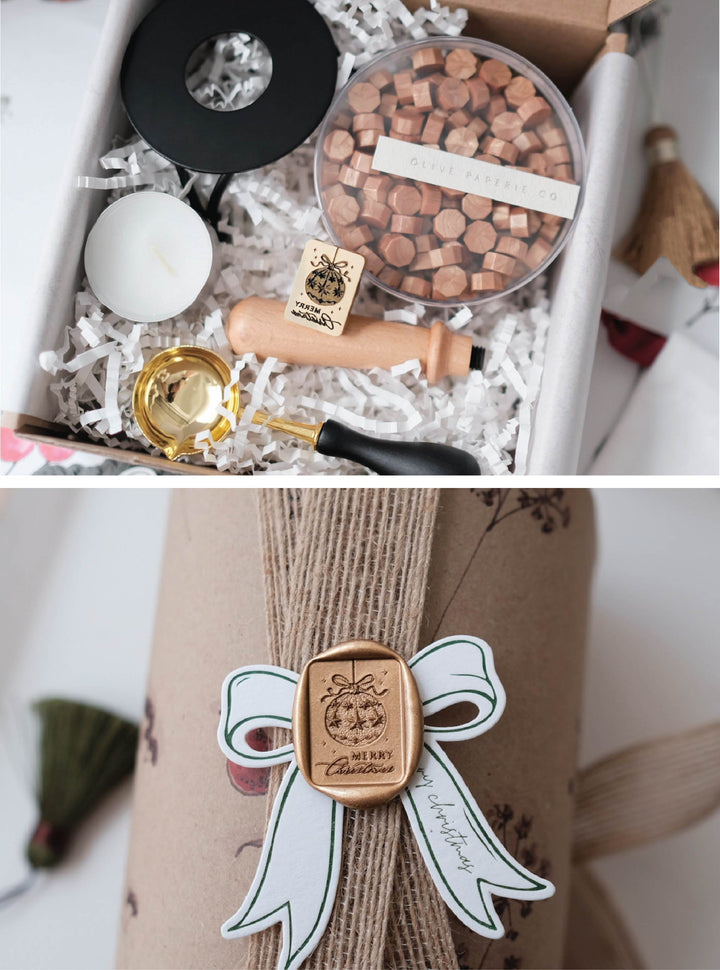 Christmas wax seal kit with Merry Christmas ornament wax stamp, peachy gold sealing wax beads, and melting tools 