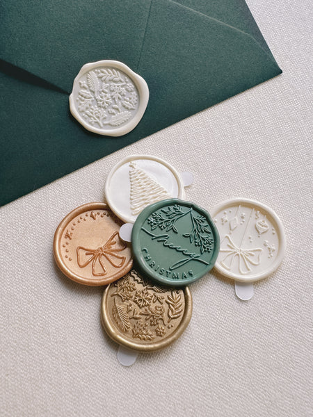 Christmas wax seals in assorted designs and colors