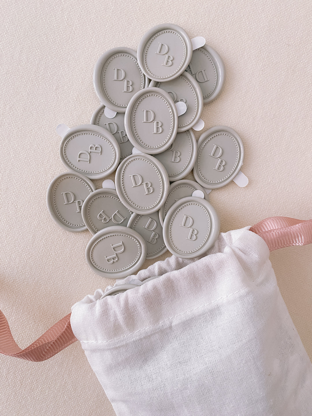 Oval border design monogram grey wax seals in linen pouch